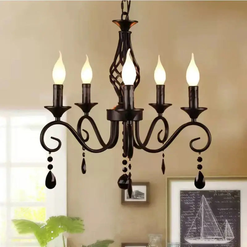 Black wrought iron decorbites crystal black chandelier with five candle style bulbs and teardrop crystals for dining room