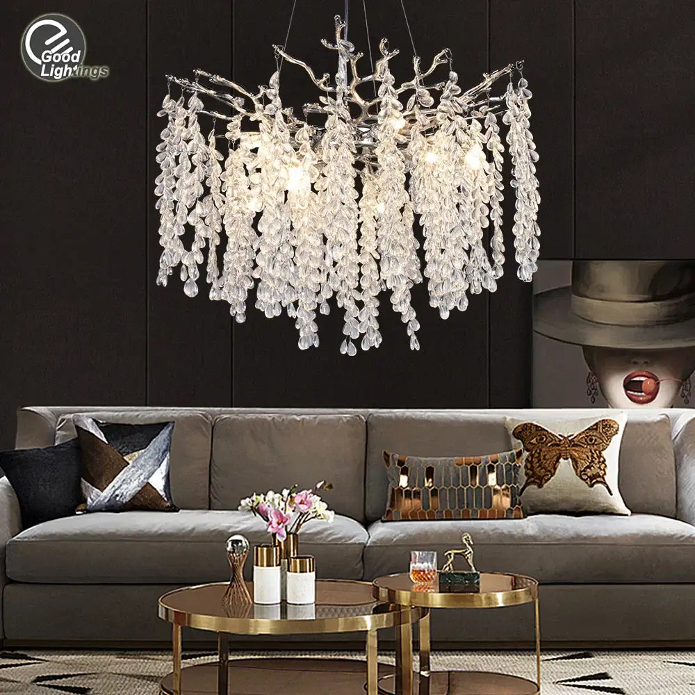 A decorbites crystal branch chandelier with silver-toned frame and cascading teardrop crystals for living room lighting