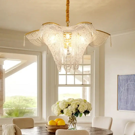 A golden-framed decorbites crystal butterfly tassel chandelier with cascading crystal beads for living room lighting