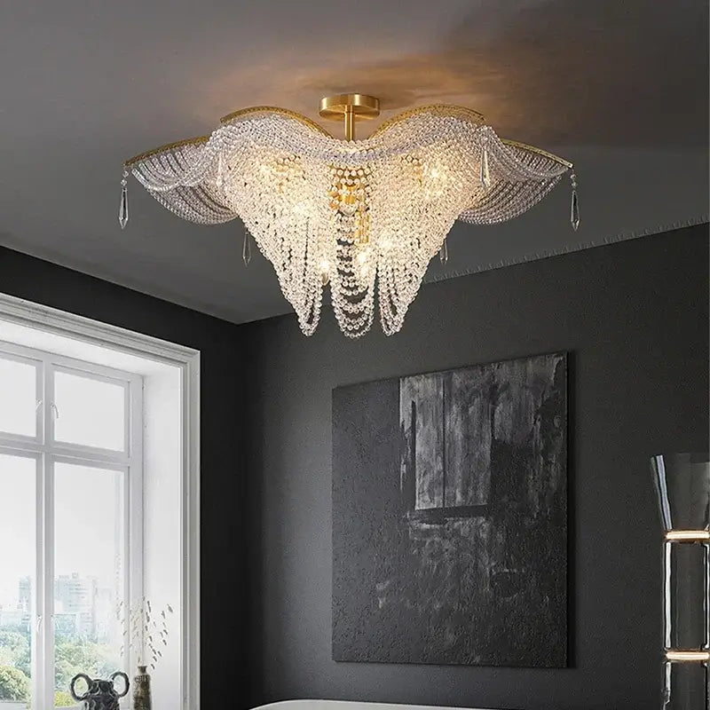Golden decorbites crystal butterfly chandelier with cascading crystal strands and wing-like tassel design for living room light