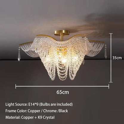 A luxurious decorbites crystal butterfly gold tassel chandelier with clear k9 crystals and copper frame for living rooms