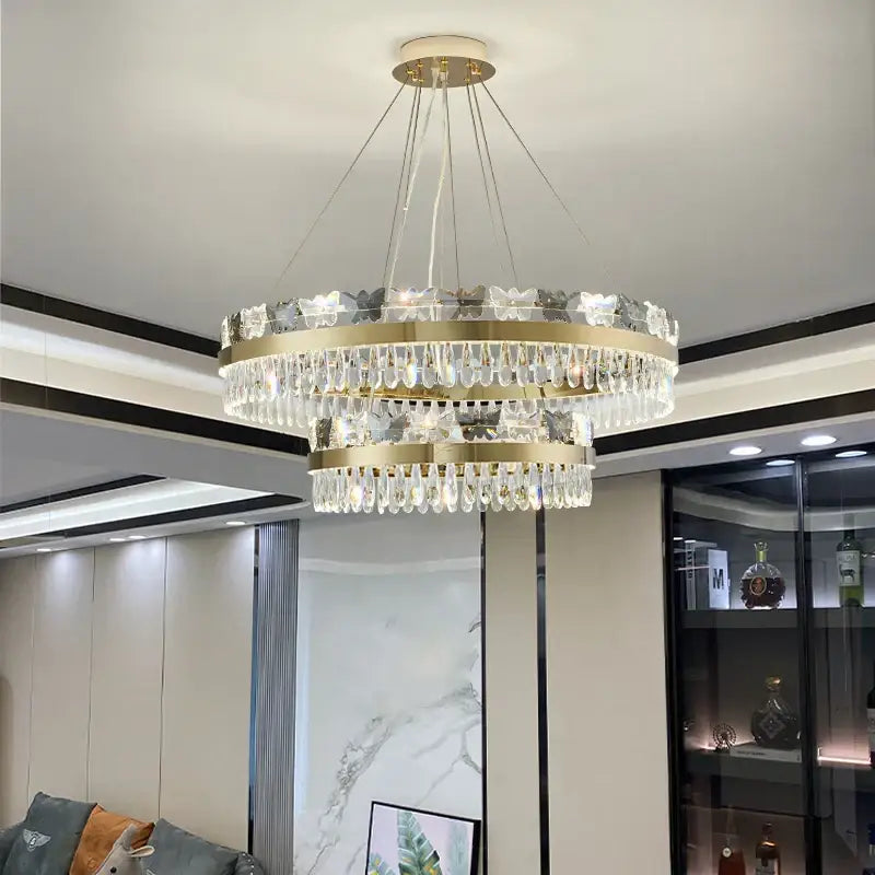 A two-tiered decorbites crystal butterfly living gold chandelier with clear crystals for butterfly living room luxury