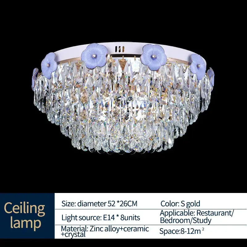 Decorbites crystal candle chandelier with circular white base, light purple floral accents, and cascading clear crystals