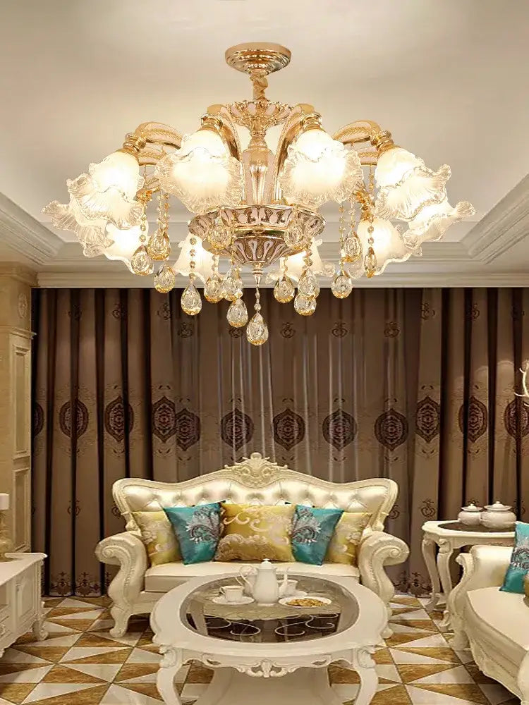 Gold-toned decorbites crystal ceiling chandelier with crystal droplets and frosted glass shades for luxury living spaces