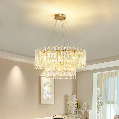 A decorbites crystal ceiling chandelier with gold-toned mount and clear glass prisms for indoor luxury lighting