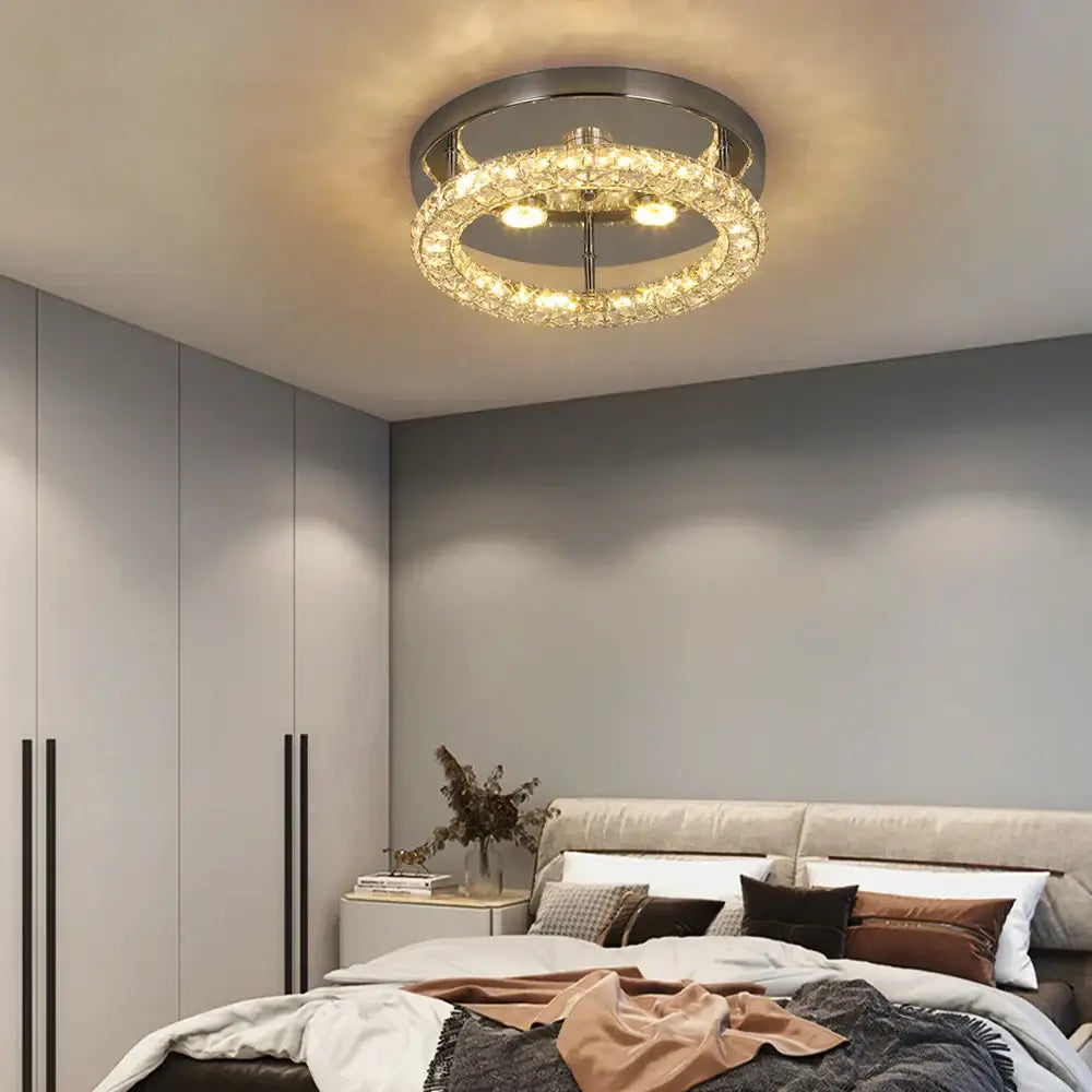 A modern decorbites crystal ceiling fan with chrome frame, multiple crystal tiers, led light, and remote control features