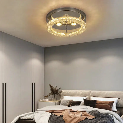 A modern decorbites crystal ceiling fan with chrome frame, multiple crystal tiers, led light, and remote control features