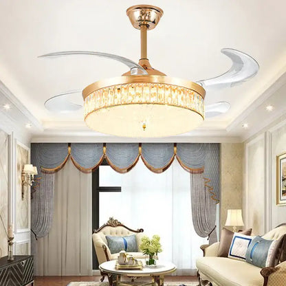 Gold-toned decorbites crystal ceiling fan with LED light, remote control, crystal-encrusted fixture, and translucent curved blades