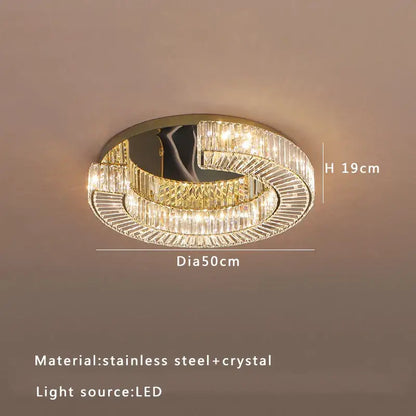Decorbites crystal ceiling lamp featuring a modern circular design with clear crystal and gold-toned stainless steel accents