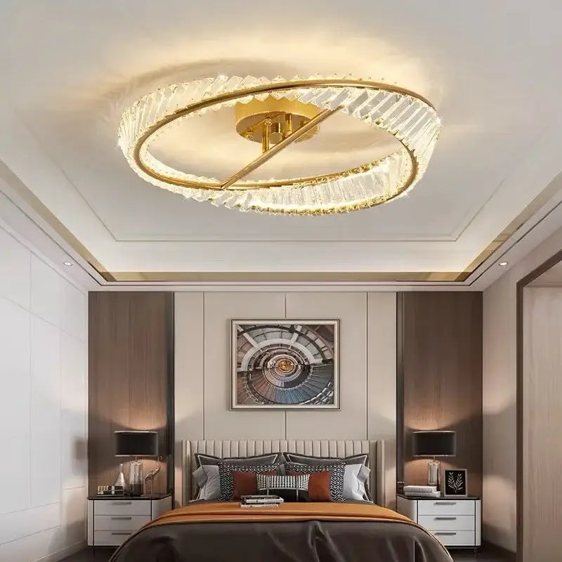 Gold-toned decorbites crystal ceiling lamp with circular rings and crystal accents for modern dining rooms