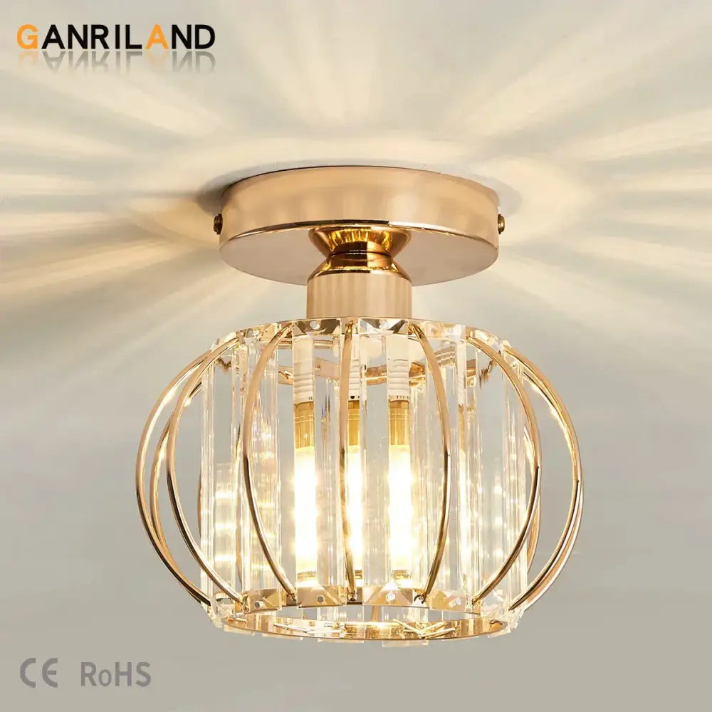 Gold-toned decorbites crystal ceiling light with crystal cage design and vertical glass rods for modern interiors