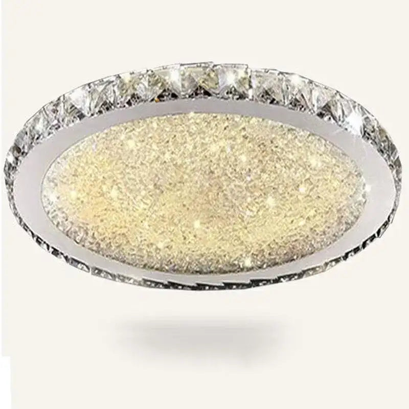 Decorbites crystal ceiling light with oval chrome frame, sparkling gold center, and faceted clear crystals for living rooms