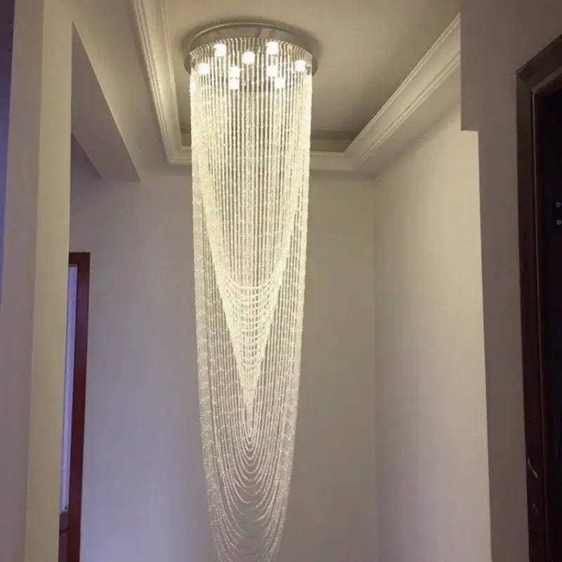 DecorBites™ crystal ceiling light with cascading clear beads and circular metallic top for stairs and living room lighting