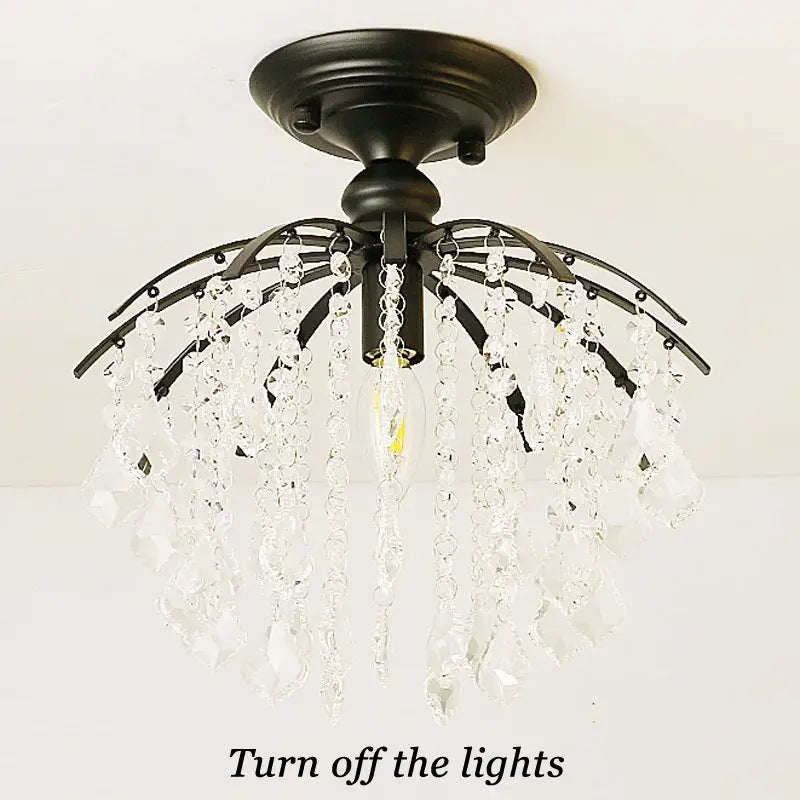 Black metal decorbites crystal ceiling light with cascading clear crystal droplets for luxury home living spaces