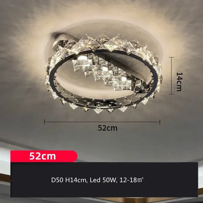 A modern oval-shaped decorbites crystal ceiling light with chrome frame and clear facets refracting warm led glow