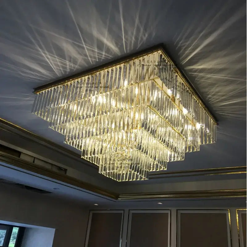 A square decorbites crystal ceiling light with gold-toned metal frame and faceted glass rods for modern vintage décor