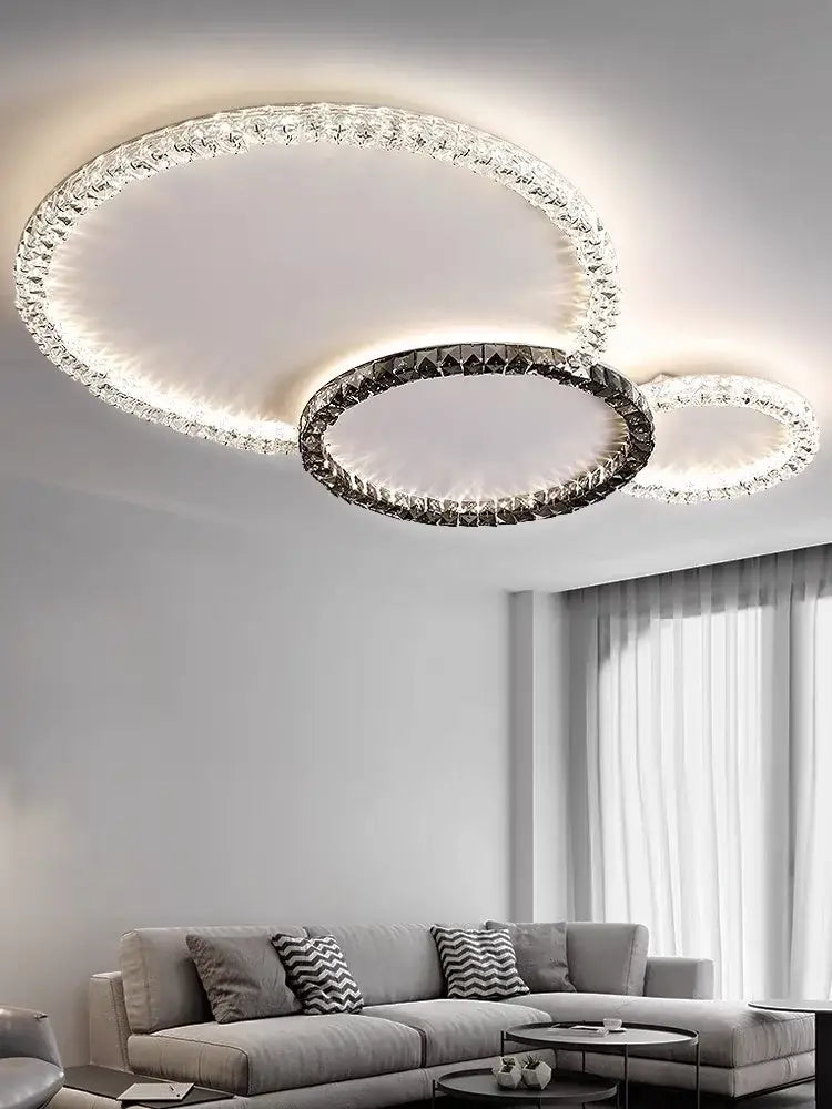 Modern decorbites crystal ceiling light with three interlocking rings adorned with crystals and metallic frame ceiling lights led