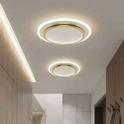 Modern decorbites crystal ceiling light with gold-toned frame, crystal-encrusted ring, and bright white led illumination
