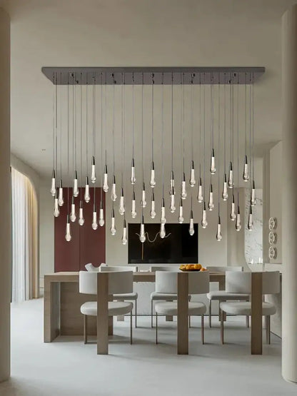 Modern minimalist decorbites crystal ceiling pendant lights with clear glass bulbs on metallic bar for dining room luxury lighting