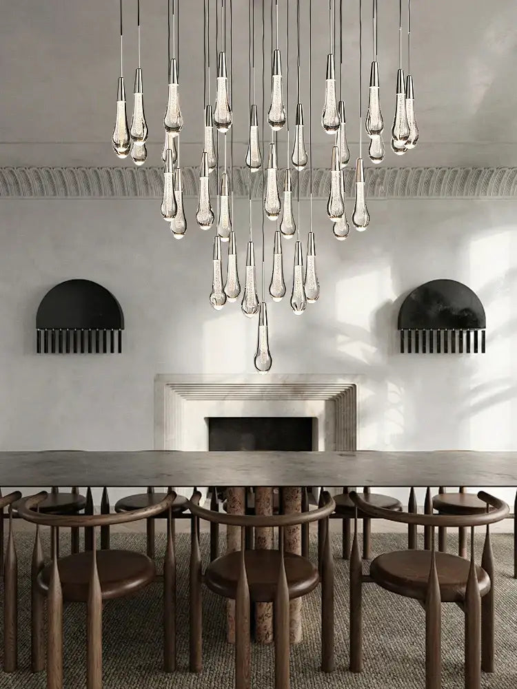 Modern teardrop-shaped decorbites crystal ceiling pendant lights with metallic fixtures for luxury dining room lighting