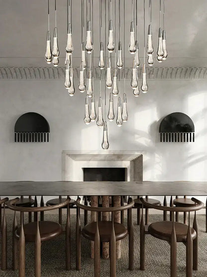 Modern teardrop-shaped decorbites crystal ceiling pendant lights with metallic fixtures for luxury dining room lighting