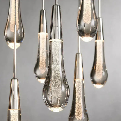 Clear glass teardrop pendant lights with silver caps and led lighting from DecorBites crystal ceiling pendant collection