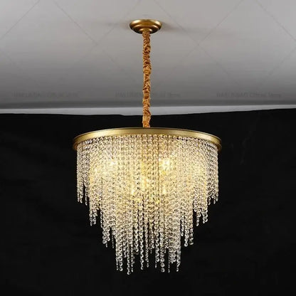 Gold-toned DecorBites crystal chandelier with cascading clear crystal beads and twisted rope pendant for modern living rooms