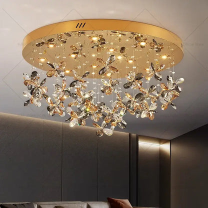 Gold-toned decorbites crystal chandelier with dangling crystal butterfly ornaments for postmodern luxury spaces