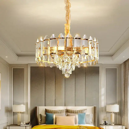 Gold-toned decorbites crystal chandelier with clear crystal prisms and matching chain for living room and bedroom lighting
