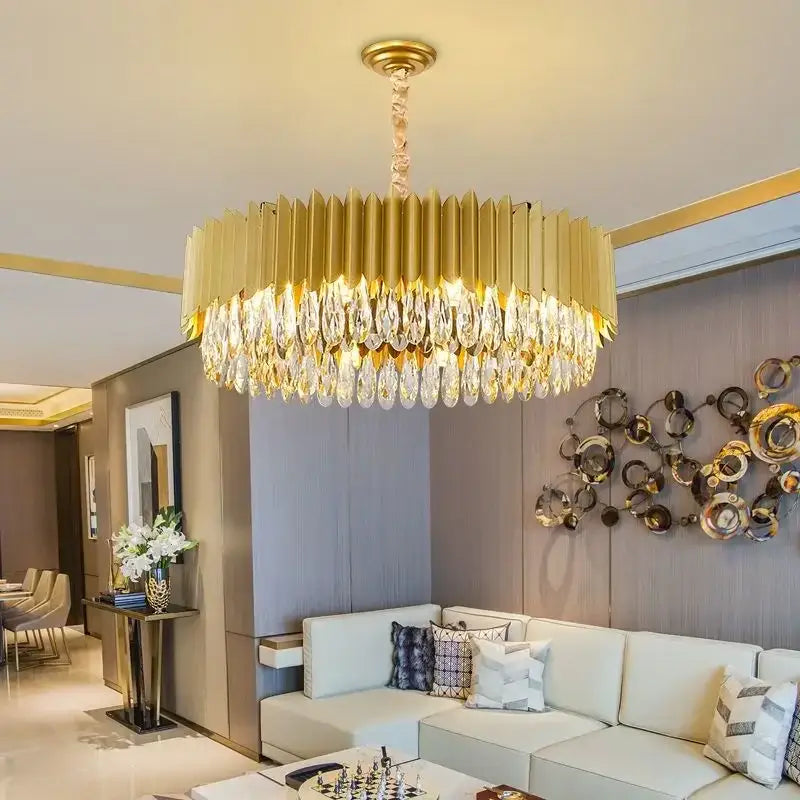 Gold-toned decorbites crystal chandelier pendant light with cascading crystal droplets and geometric design for living room