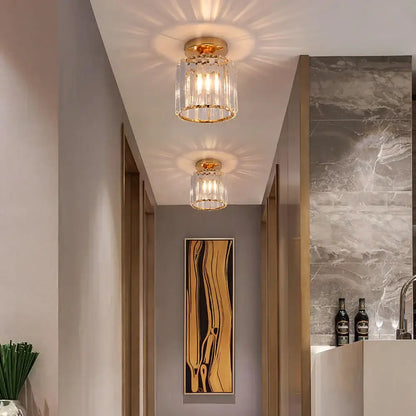 Gold-finished decorbites crystal chandelier ceiling light with cylindrical glass shade and multiple exposed bulbs