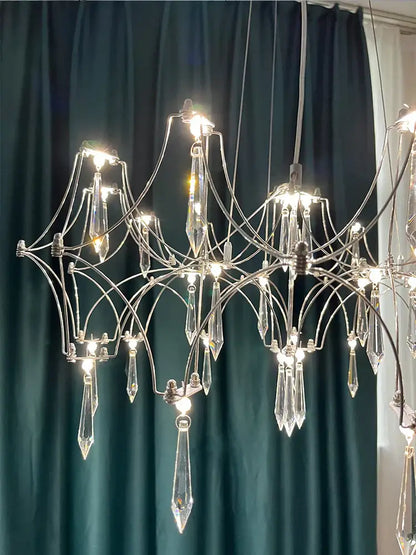 Elegant decorbites crystal chandelier pendant light with sleek chrome frame and faceted glass prisms for home lighting