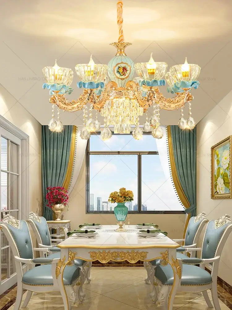 Decorbites crystal chandelier with gold-toned metalwork crystal droplets and light blue accents for luxe living room lighting