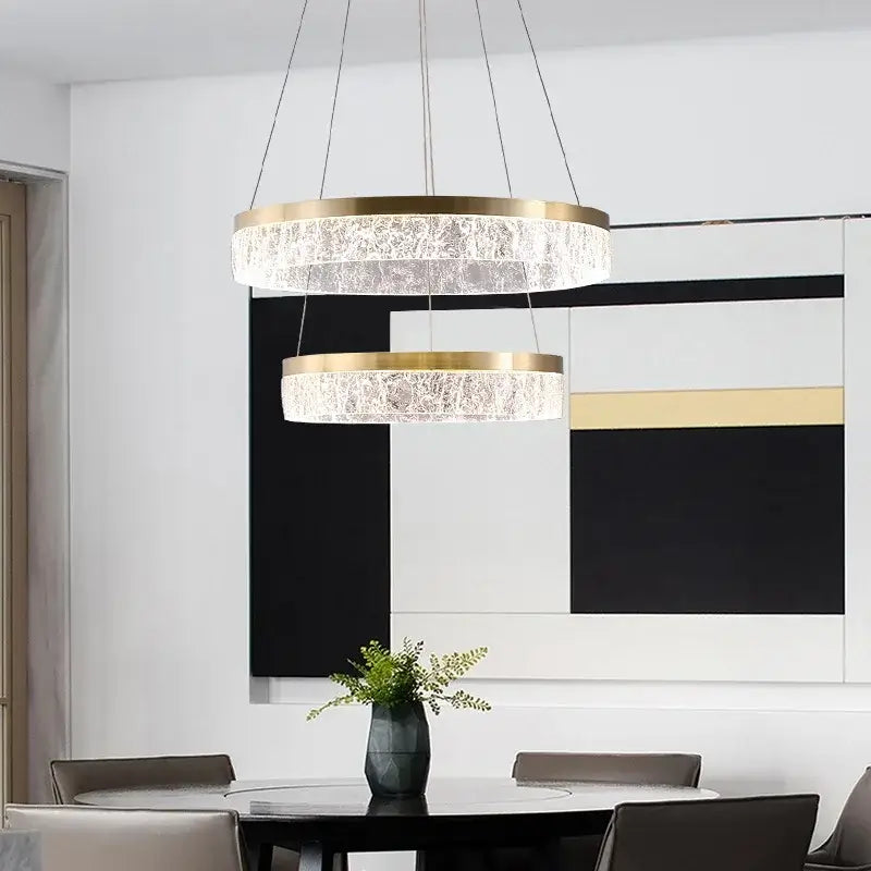 Modern double-tiered pendant light with gold-toned metal frames and clear crystal rings by decorbites crystal chandelier