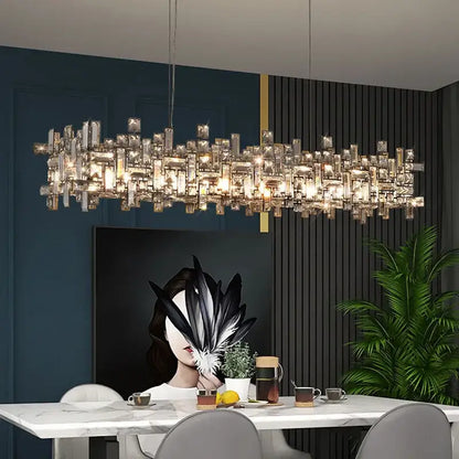 A modern decorbites crystal chandelier with clear crystal prisms in a cascading design for living rooms