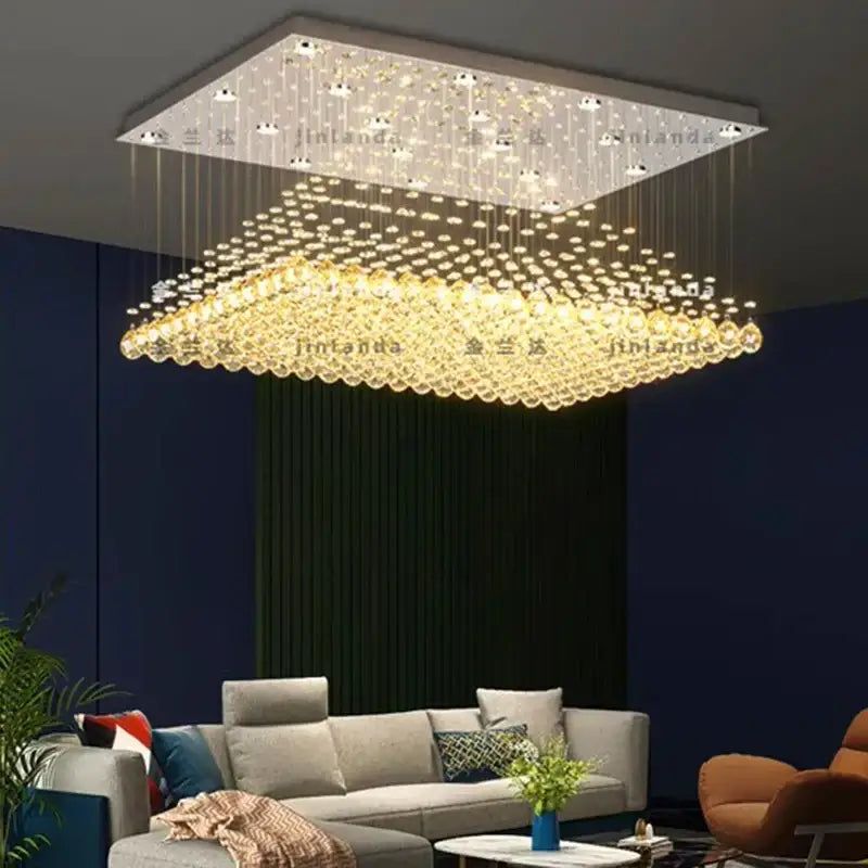 Decorbites crystal chandelier with cascading golden droplets and modern metallic frame for indoor dining rooms