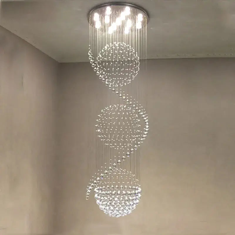 A modern decorbites crystal chandelier with cascading crystal beads and metallic mount for hotel and villa halls