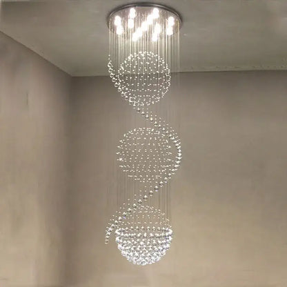 A modern decorbites crystal chandelier with cascading crystal beads and metallic mount for hotel and villa halls