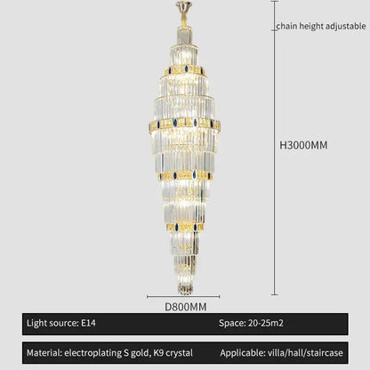 A tall elegant decorbites crystal chandelier with cascading clear k9 crystals and gold electroplated accents for duplex staircases