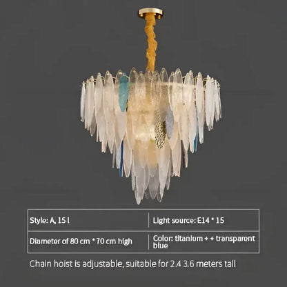 A DecorBites crystal chandelier with cascading translucent titanium and blue glass shards suspended by a gold chain