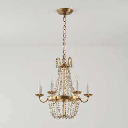 Delicate gold-toned DecorBites crystal chandelier with cascading clear beads and five candle-style bulbs for elegant spaces