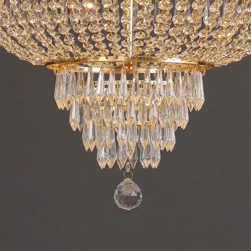 Luxurious decorbites crystal chandelier with gold-toned frame and cascading clear faceted crystals for elegant living spaces