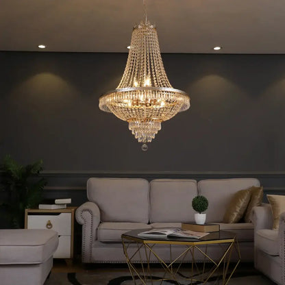 Decorbites crystal chandelier with gold-toned metal frame and clear faceted crystals for luxury living spaces
