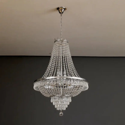 Elegant multi-tiered decorbites crystal chandelier with polished chrome finish and cascading clear crystals for luxury living spaces