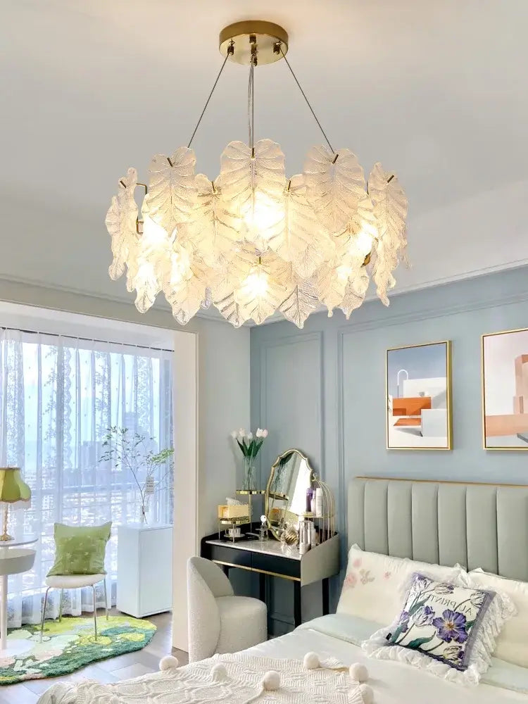 DecorBites crystal chandelier with translucent leaf-shaped glass shades and gold-toned fixture for elegant living spaces