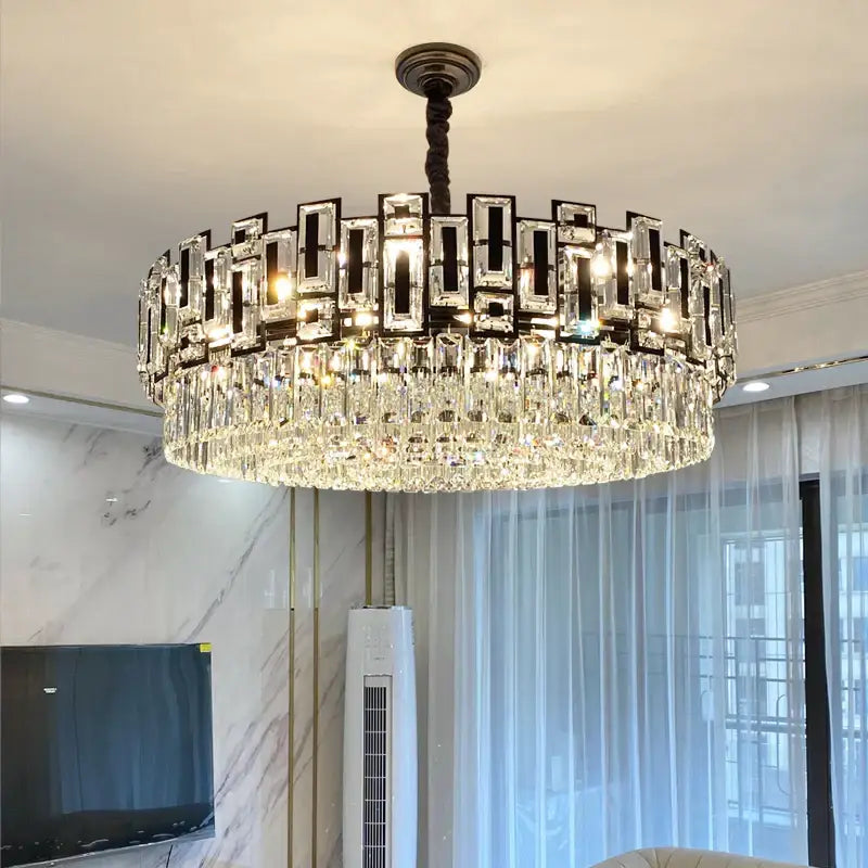 A modern decorbites crystal chandelier with dark metal frame and cascading clear crystals for elegant home lighting