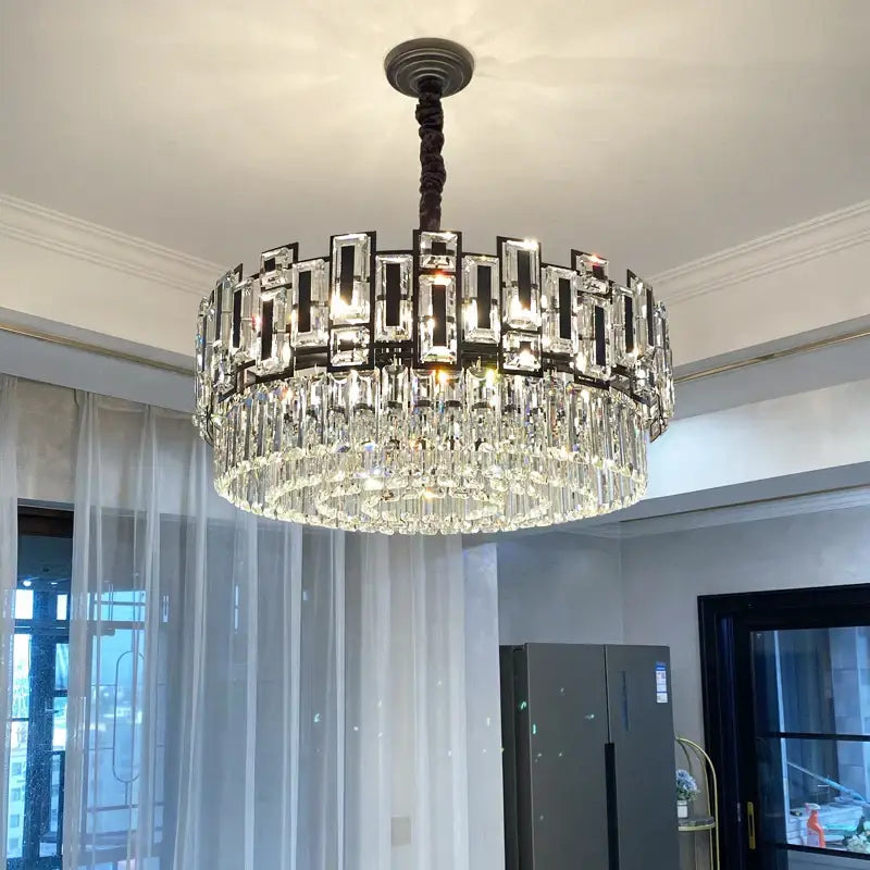 A modern decorbites crystal chandelier with dark metal frame rectangular crystals and clear glass prisms for elegant lighting
