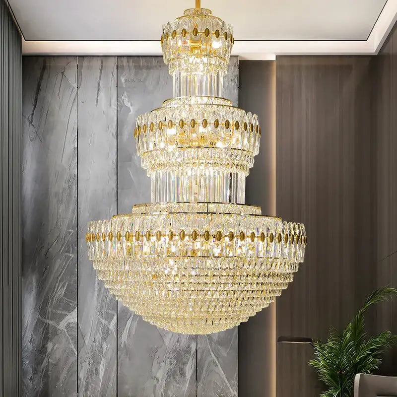Decorbites crystal chandelier with gold accents and cascading clear crystals for elegant home and hotel lighting