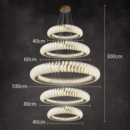 A modern decorbites crystal chandelier with cascading clear crystal rings and gold-toned metal for elegant living areas
