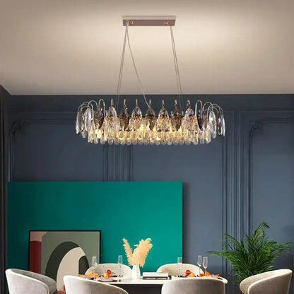 A modern decorbites crystal chandelier pendant light with circular design featuring clear and dark glass elements